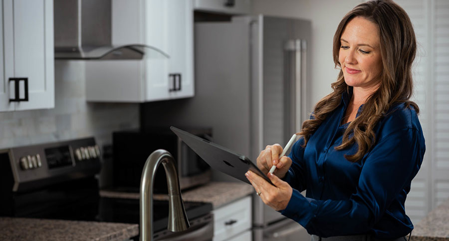 Curbio demo image – woman in kitchen